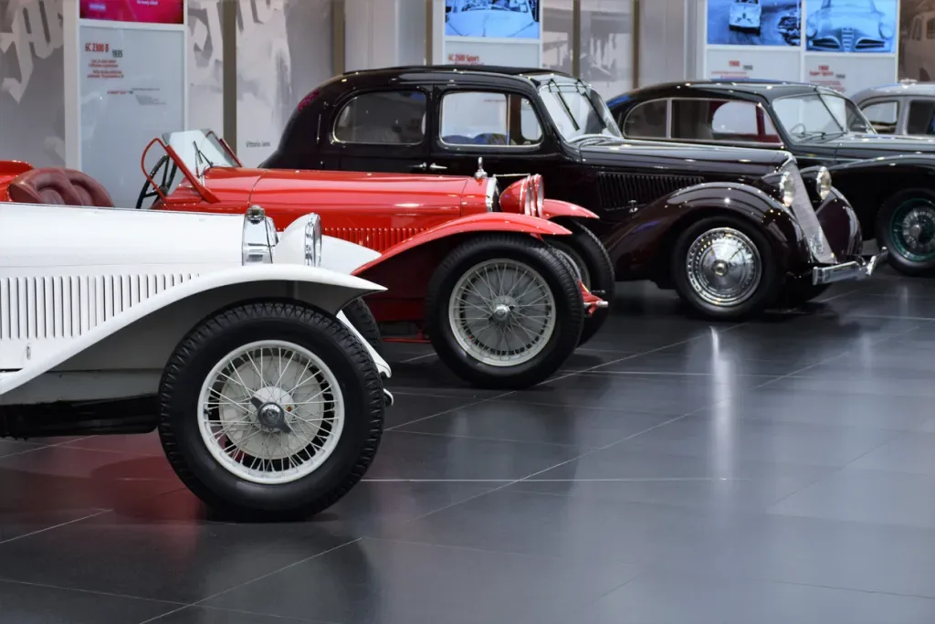 A row of classic Alfa Romeo vehicles. Brunk Auction House might auction off cars like these.