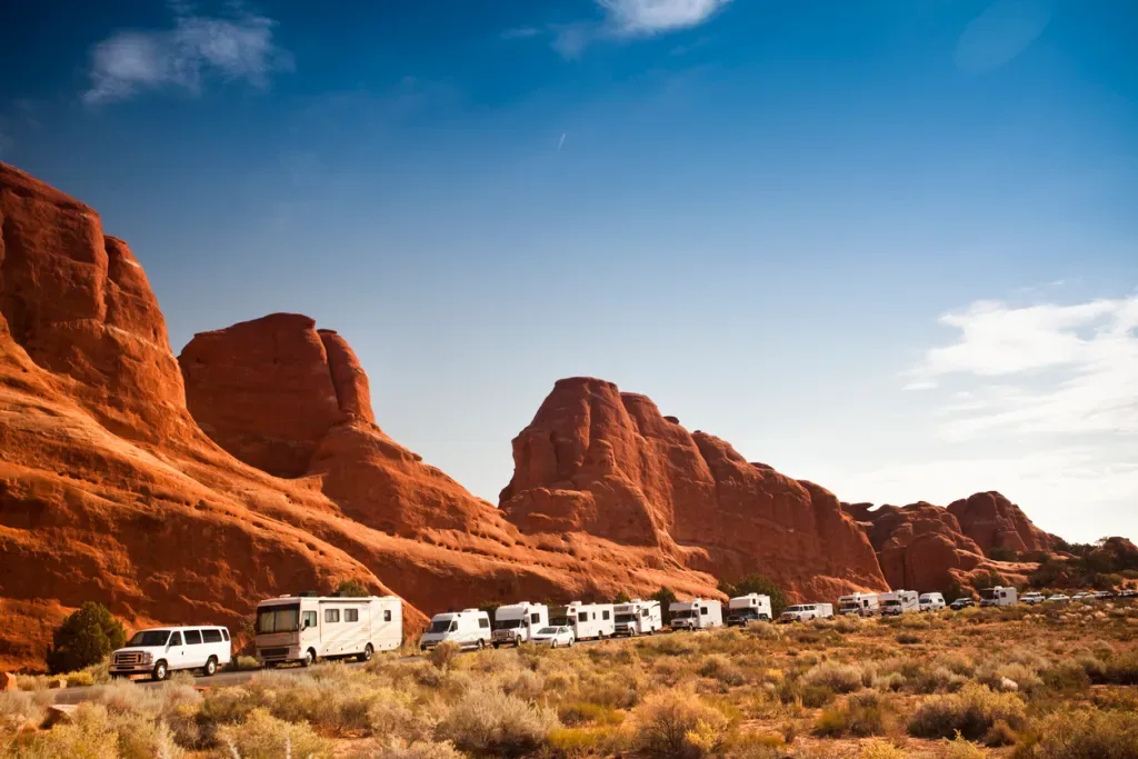 A long line of RVs at Arches National Park in Utah. Overcrowded destinations is one of the reasons people are leaving RV life.