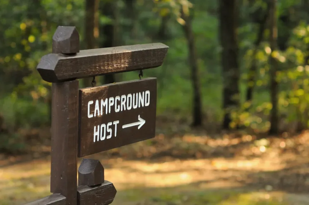 Sign with arrow for campground host