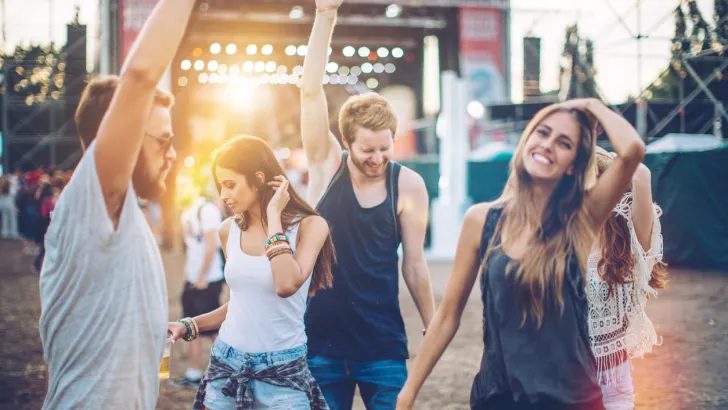 Friends having fun at a music festival