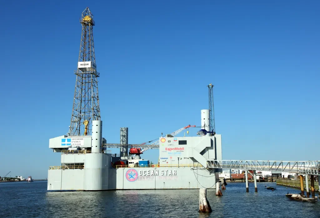Daytime view of the retired jack-up rig set up in the Galveston harbor next to the Strand National Historic Landmark District