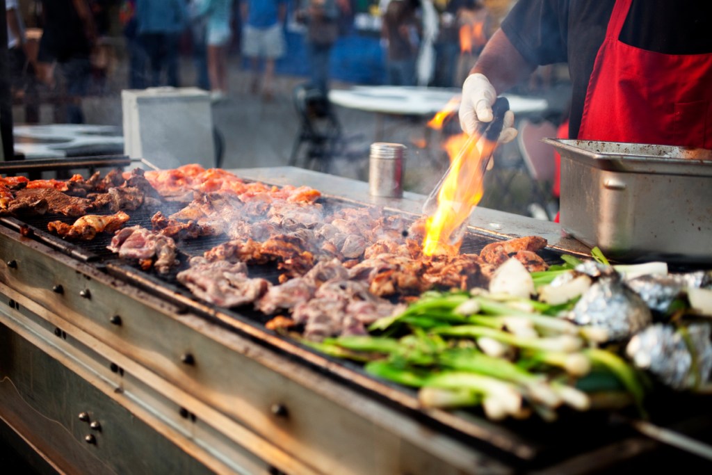 Meat and vegetables on a grill like you might find at Hogs for the Cause
