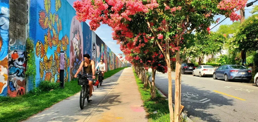 Biking by Murals in Inman Park Atlanta on the BeltLine is an affordable option