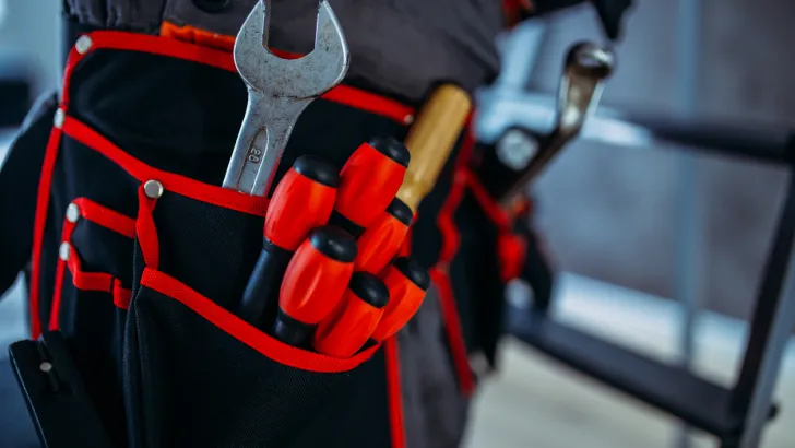 Close-up of a toolbelt with tools like you might use on an RV