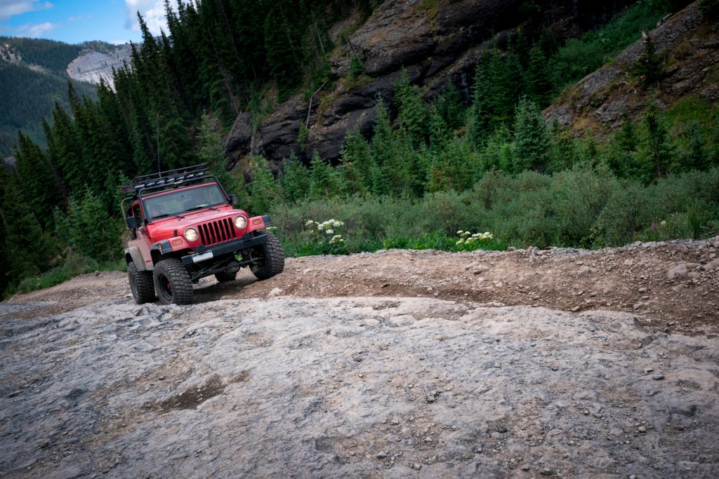 Jeep traveling a mountain trail in the Southwest