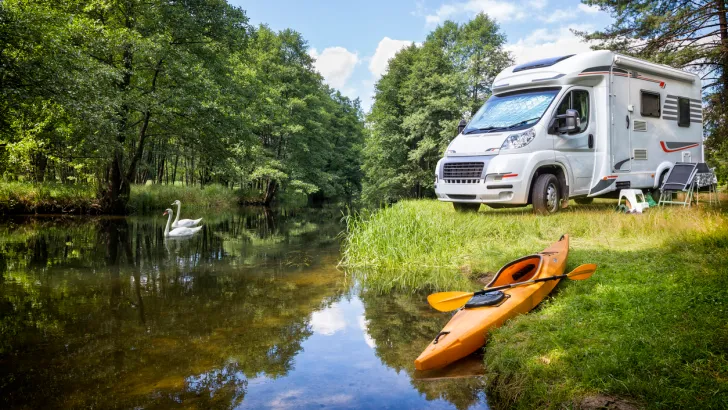 An RV boondocking near a creek, perhaps in Asheville North Carolina