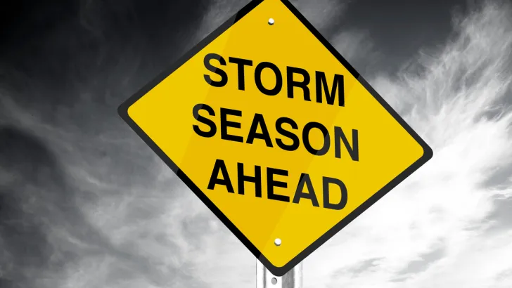 Storm season ahead road sign, warning people tornadoes might be coming