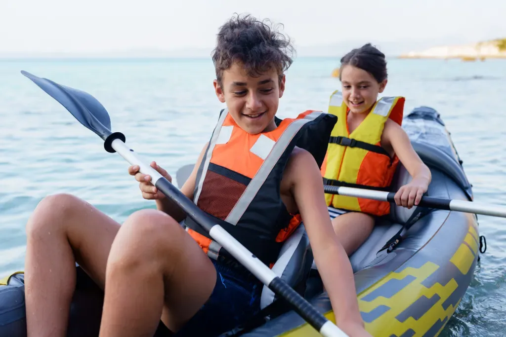 Kids on an inflatable kayak