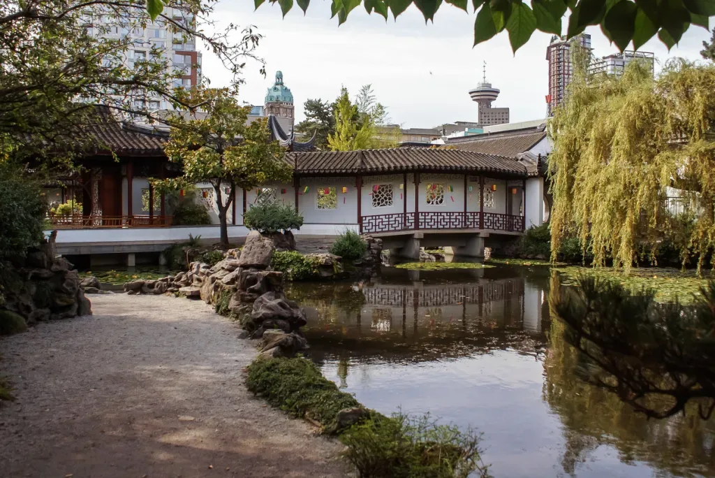 A building sits beside a waterway in Vancouver's Dr. Sun Yat-Sen Classical Chinese Garden.
