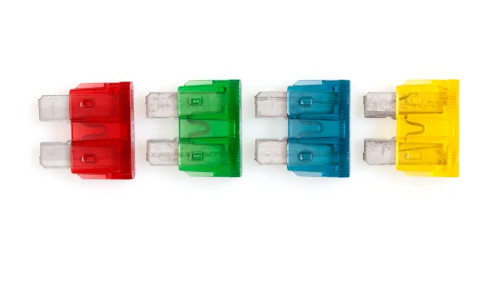 Four colorful fuses lined up in a row against a white background.