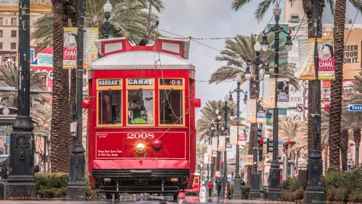 A street car travels down the road in New Orleans.