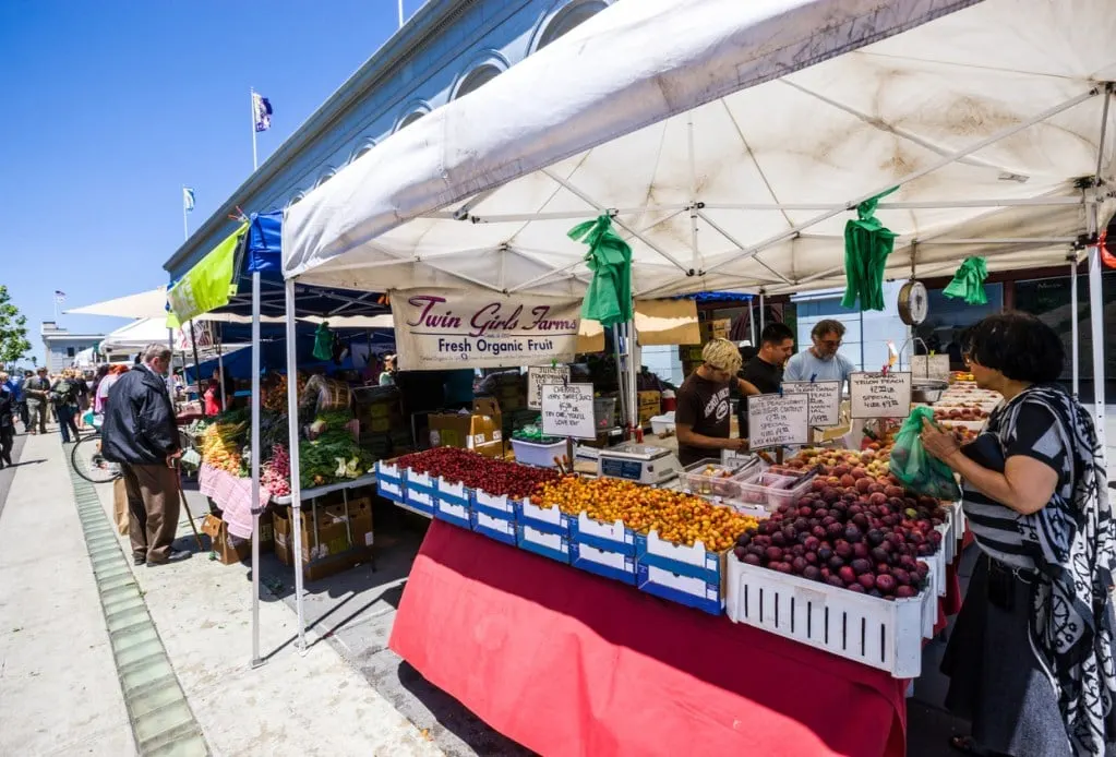 A produce stand at the weekly farmers market at the iconic Bay Area building.