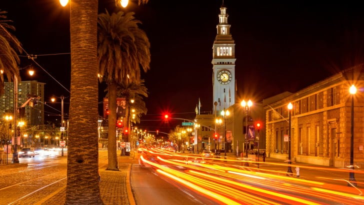 A long exposure of San Francisco's Ferry Building at night.